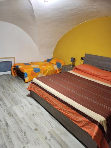 a room with two beds in a room with at Chimera House in Catania