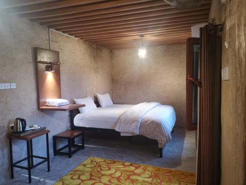 Postel nebo postele na pokoji v ubytování Durrat Al-Misfah Guest House
