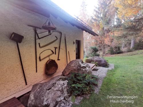 a building with a rock and a sign on it at Ferienwohnungen Kremser bei Spiegelau Eppenschlag in Eppenschlag