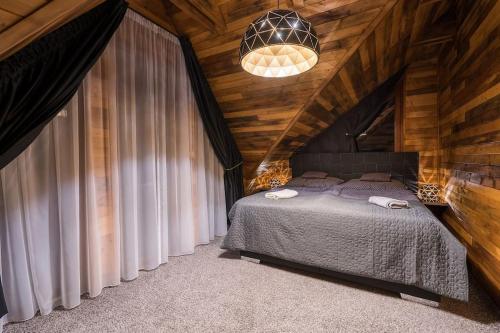 Cama o camas de una habitación en Luxury Chalet in High Tatras
