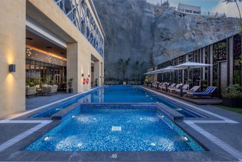 a swimming pool in the middle of a building at Citadines Abha in Abha