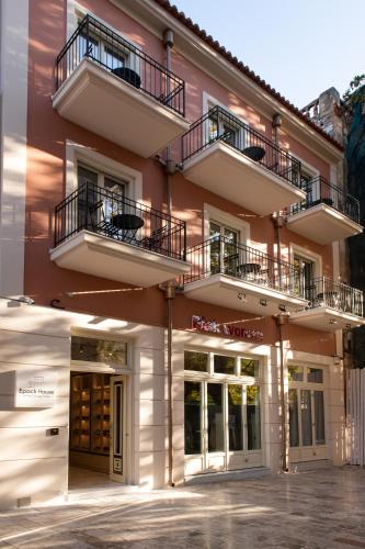 a building with two balconies on top of it at Epoch House & The Orange Shop - Adults Only in Nafplio