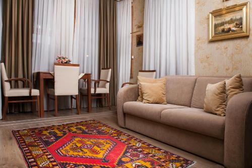 a living room with a couch and a dining room at Sultanahmet Suites in Istanbul