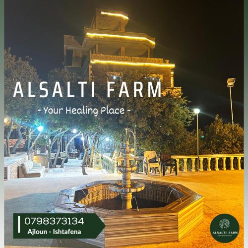 a water fountain in front of a building at night at AlSalti Farm - مزرعة السلطي in Ajloun