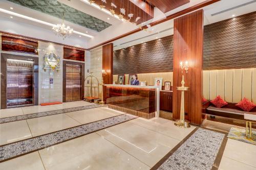a lobby of a hotel with a reception desk at Hotel Gurudev Grand in Kalyan