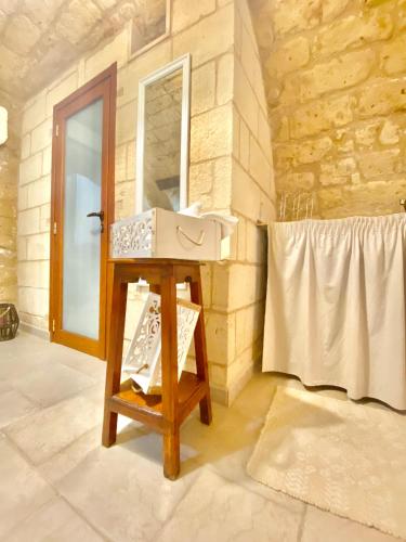 a bathroom with a sink and a mirror at Dimora Pietra Antica in Bari