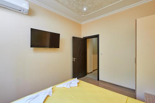 Postel nebo postele na pokoji v ubytování Къща за гости КИТАНОВ