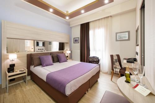 Säng eller sängar i ett rum på Hotel Trapani In