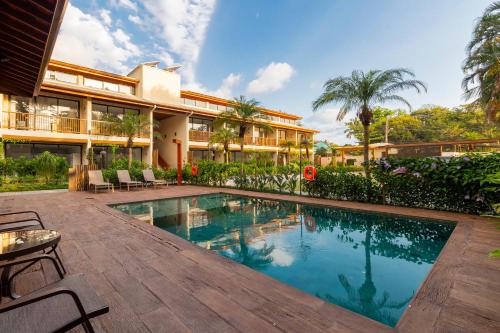 an image of a swimming pool in a house at Anoa Maresias Studios in Maresias