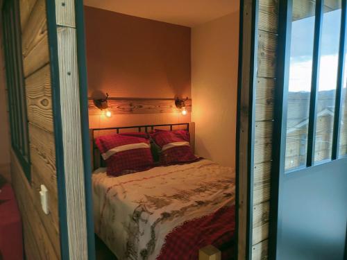 Postel nebo postele na pokoji v ubytování Fleurs des Alpes