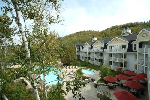 an aerial view of a resort with a swimming pool at Château Beauvallon in Mont-Tremblant