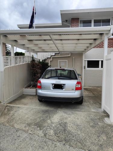 a white car parked in a garage at Home Away From Home in Richmond