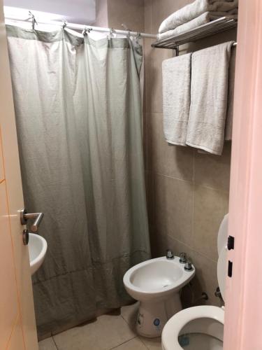 a bathroom with a shower and a toilet and a sink at 11 De Septiembre 3255 in Mar del Plata