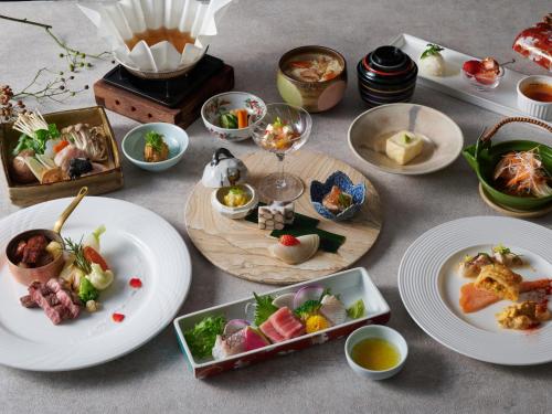 a table with plates of food on it at Hotel Laforet Nasu in Nasu