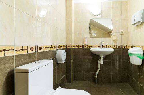 a bathroom with a toilet and a sink at Luxury Studio for 3 persons, near Carevec, Veliko Tarnovo in Veliko Tŭrnovo