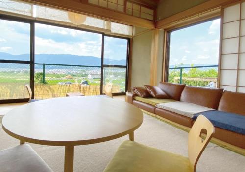 a living room with a couch and a table at Kudonoie - Vacation STAY 31960v in Kudoyama
