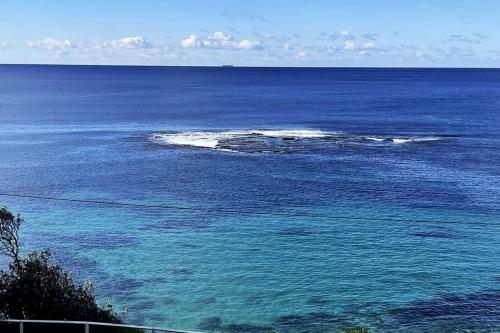 an island in the middle of a large body of water at Beachside Apartment Blackwoods Beach in Cronulla