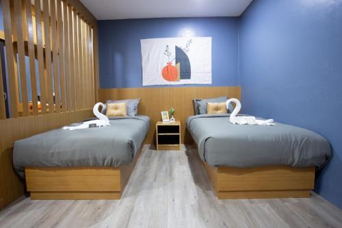 Postel nebo postele na pokoji v ubytování The Sun resort Ratchaburi