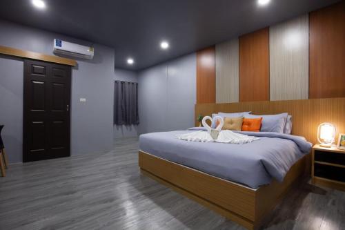 Postel nebo postele na pokoji v ubytování The Sun resort Ratchaburi