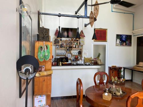 a dining room with a table and a counter at Bloom Garden Bed & Breakfast in Siem Reap