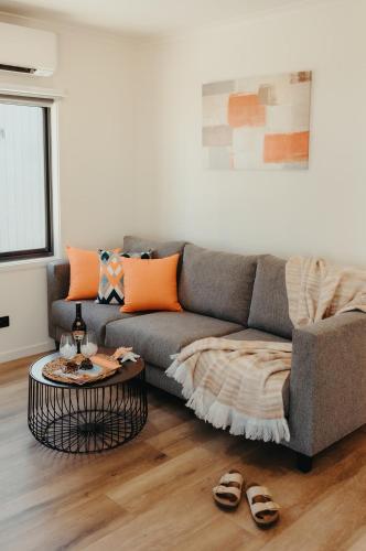 a living room with a couch and a table at Ceduna Foreshore Caravan Park in Ceduna