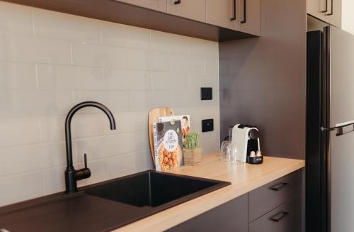a kitchen with a sink and a counter top at Ceduna Foreshore Caravan Park in Ceduna