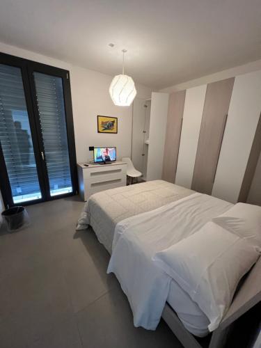 a bedroom with a bed and a television in it at Donati Business Rooms in Subbiano