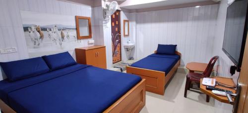 Postel nebo postele na pokoji v ubytování S.S.K RESIDENCY
