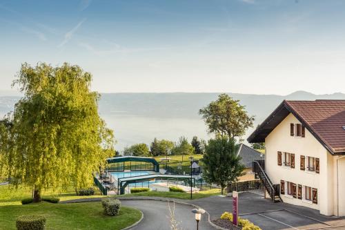 an aerial view of a house and a playground at Garden & City Evian - Lugrin in Lugrin