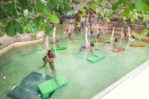 a group of people in the water at a swimming pool at Luxury Avoriaz Chalet with hot tub in Avoriaz