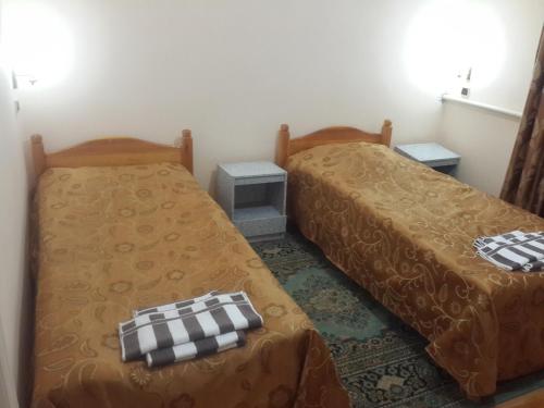 Кровать или кровати в номере Islambek Khiva