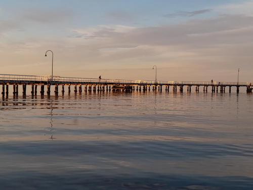 a pier in the middle of the water at beautiful apartment 100mts near the beach in Port Melbourne in Melbourne