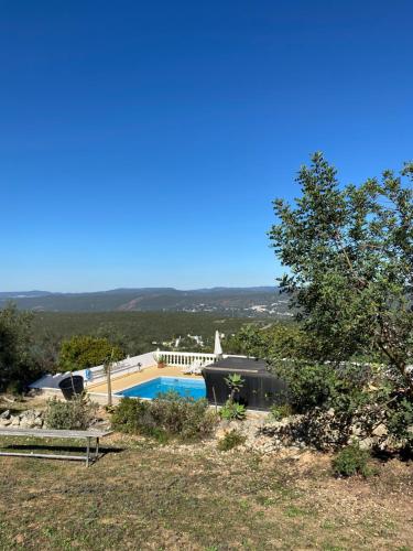 a house with a swimming pool in a yard at Casa da azinheira in Loulé