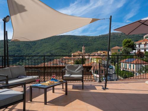 a balcony with a view of a mountain at Apartment Rosa - PTB150 by Interhome in Pietrabuona