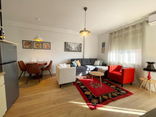 a living room with a couch and a table at Metro Suites in Tirana