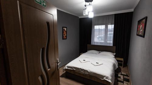 Postel nebo postele na pokoji v ubytování Casa Nicula