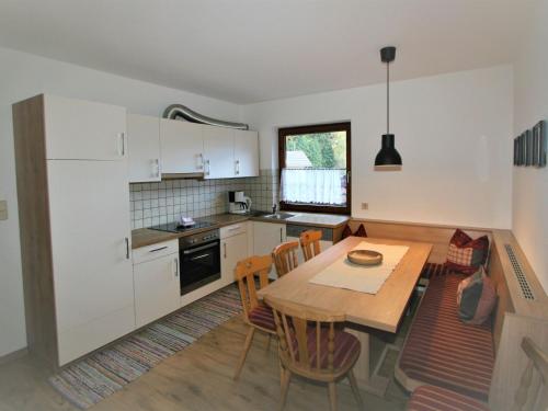 a kitchen and dining room with a table and chairs at Apartment Lisa by Interhome in Neustift im Stubaital