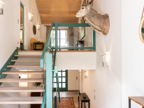 a house with a deer head hanging on the wall at Holiday Home Katschberg 8 by Interhome in Rennweg