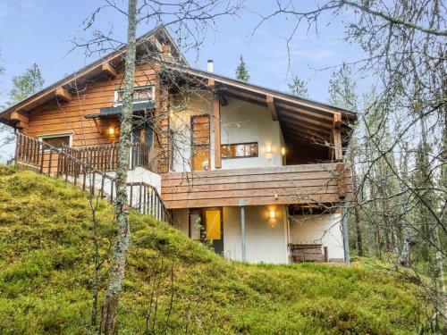 a house on top of a hill in the woods at Holiday Home Sallan lumous a by Interhome in Salla
