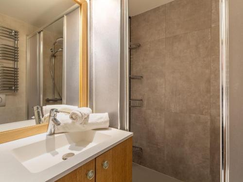 a bathroom with a sink and a shower at Studio Palafour - Le Lac-5 by Interhome in Tignes