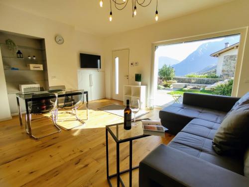 a living room with a couch and a table at Apartment Ronscione Bellavista by Interhome in San Cassiano