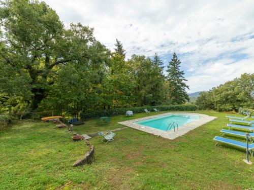 an image of a backyard with a swimming pool at Holiday Home Il Feudo by Interhome in Poggioni