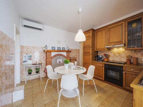 a kitchen with a table and chairs in a room at Holiday Home Casa Giulia by Interhome in Seravezza