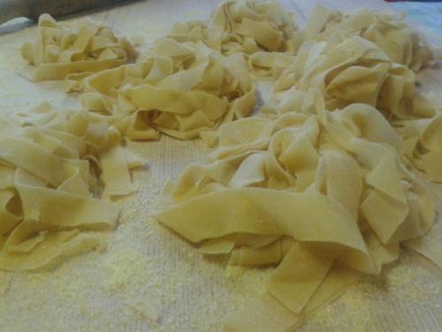 a pile of uncooked pasta on a cutting board at Agriturismo San Vito in Crocemaroggia