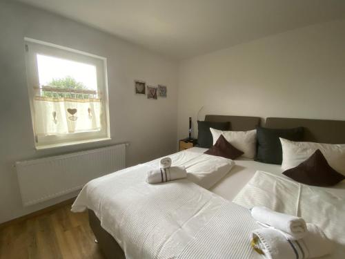 a bedroom with two beds and a window at Panoramahotel Lilienstein in Königstein an der Elbe