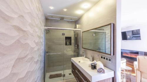 a bathroom with a shower and a sink with a mirror at Casa Aisea 2 Torre del Mar by Ruralidays in Torre del Mar
