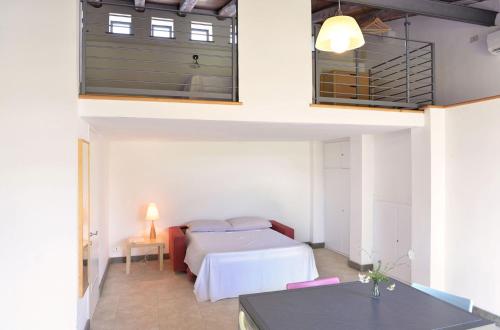 a bedroom with a bed and a table in a room at Agriturismo Arte et Agricoltura in Tuscania