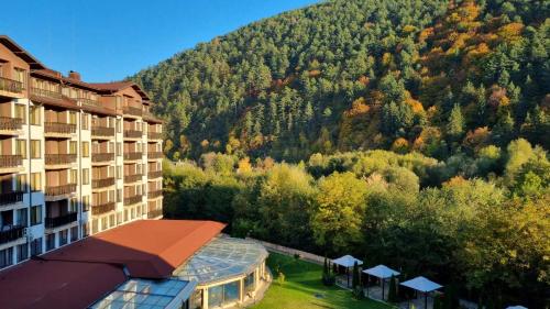 an aerial view of a hotel and a mountain at Мия 3 Спа хотел Свети Спас in Velingrad