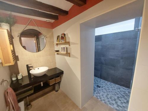 a bathroom with a sink and a mirror at Ca La Abuela in Requena