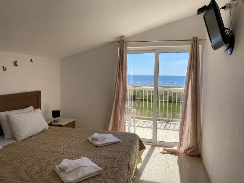Postel nebo postele na pokoji v ubytování Mediterranean Blue